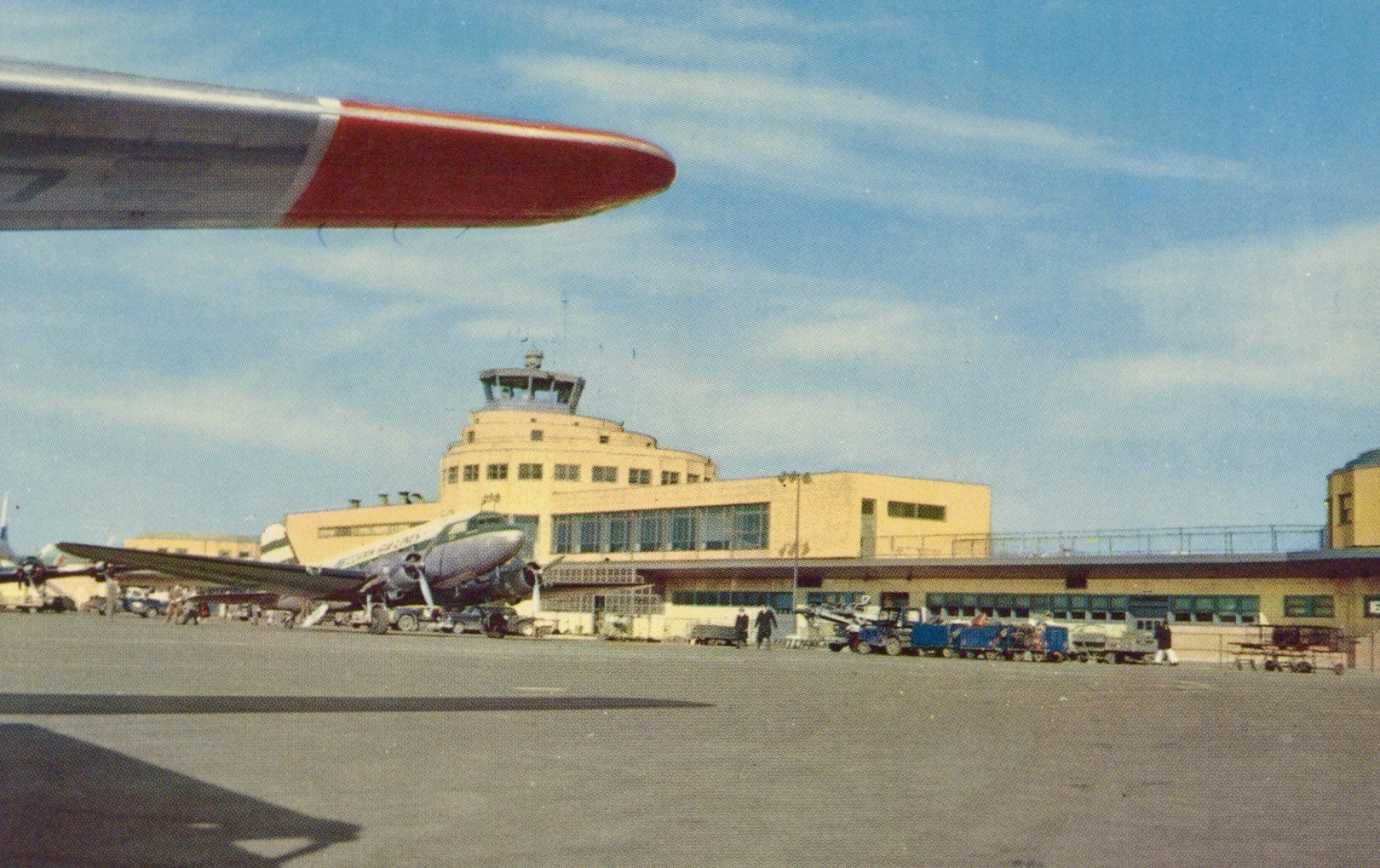 Ramp side of Midway’s new terminal building, with a Delta Air Lines Douglas DC-3. 1950s. 